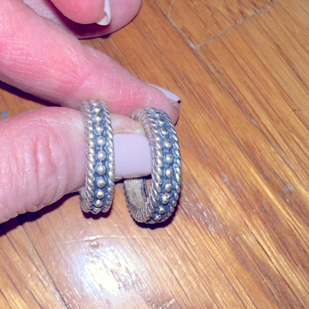Sterling silver embossed smallish hoop earrings.